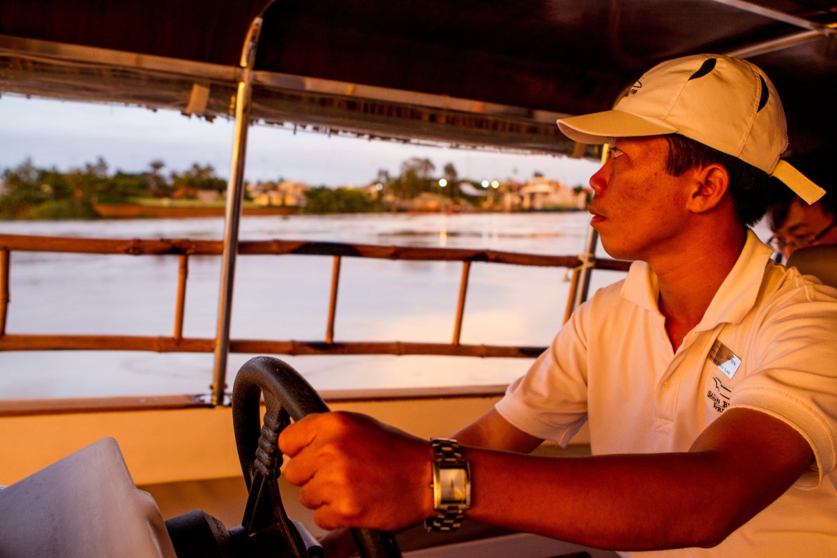 Captain of a speedboat sailing along Sai Gon river